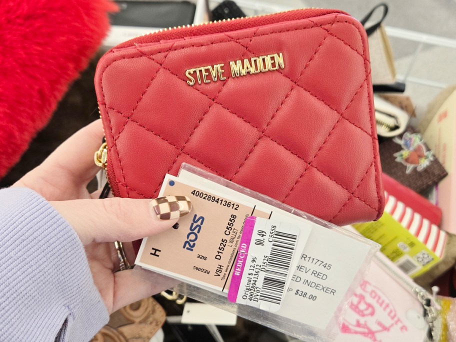 hand holding steve madden wallet with ross clearance tag