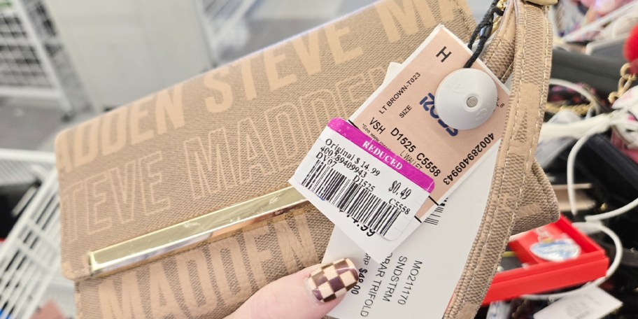 hand holding steve madden wallet with ross clearance tag