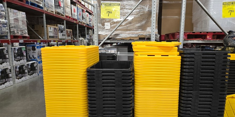 yellow and black totes stacked in store 