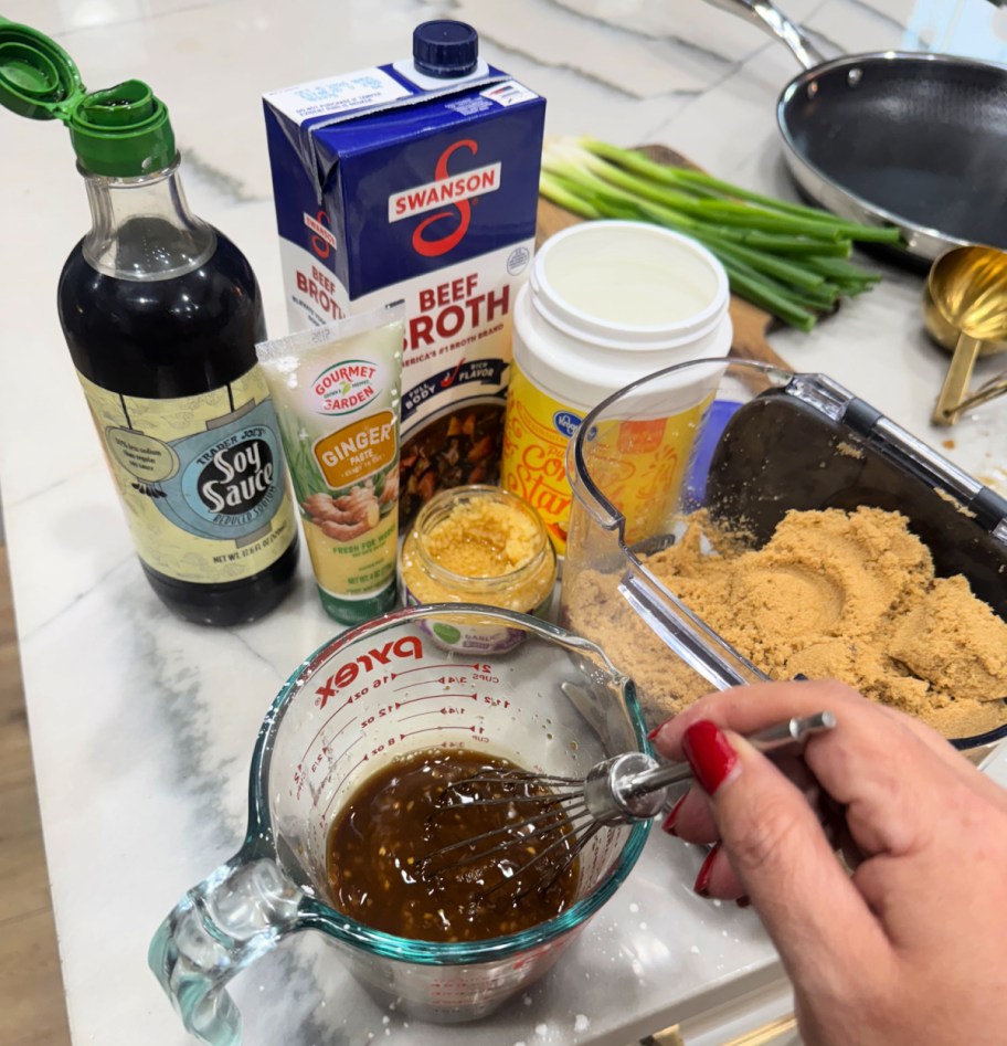 whisking together sauce for beef and broccoli