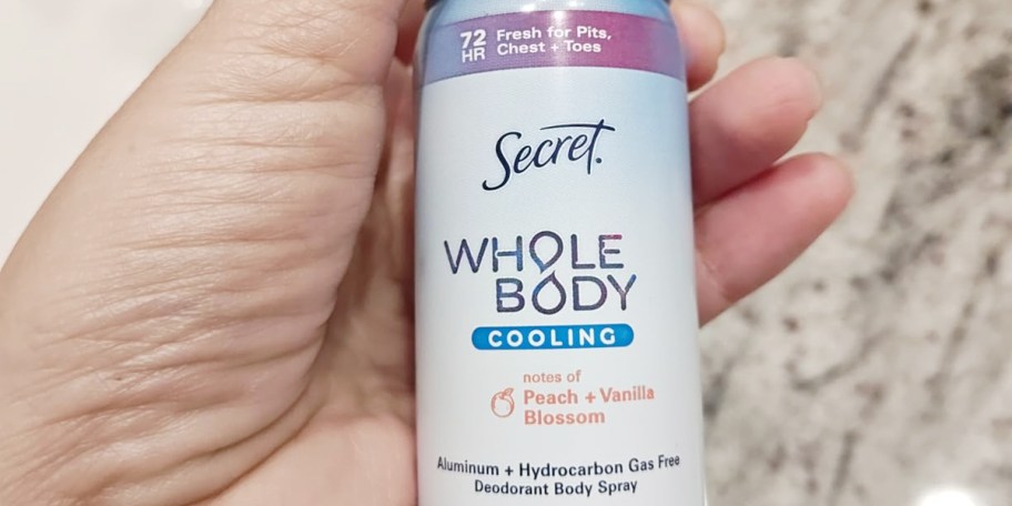 hand holding secret whole body deodorant