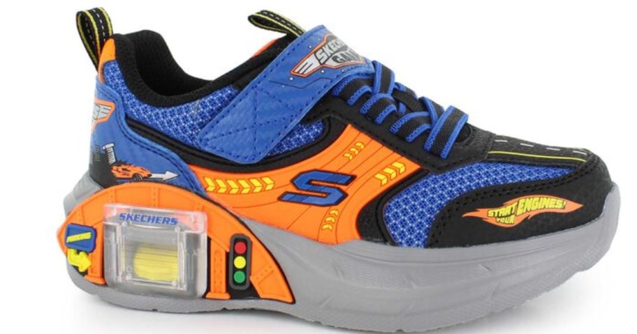 a kids Skechers shoe with a garage in the sole and a mini car inside it