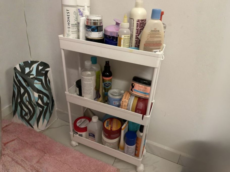 slim rolling storage cart in bathroom