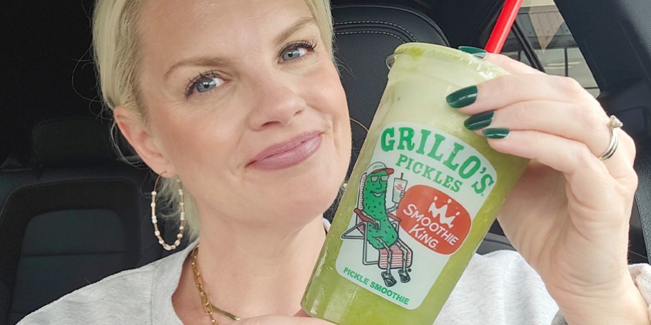 Woman holding pickle smoothie