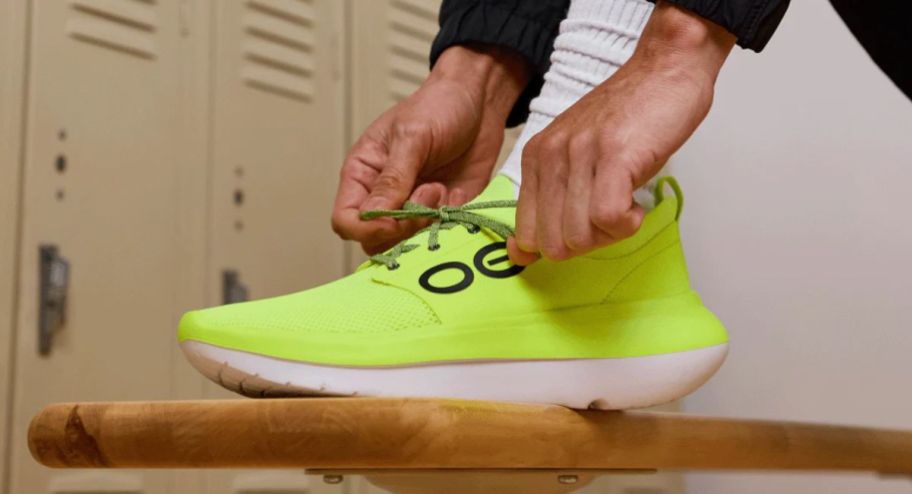 person tying their sneakers