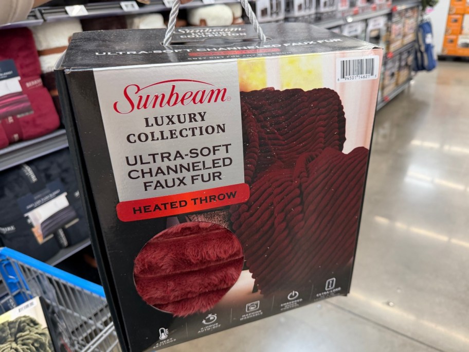 holding a heated blanket in a box