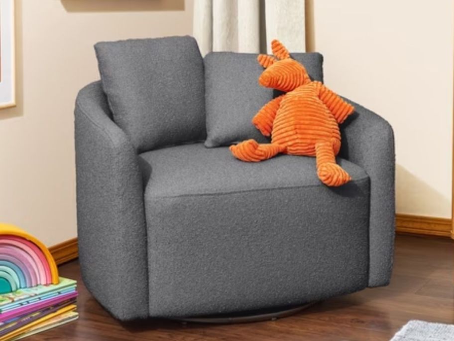 swivel gray kids chair with orange teddy on it 