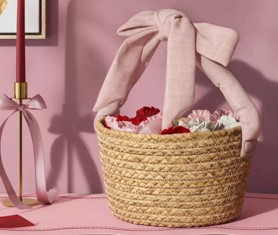 pink bow basket with scrunchies on pink tablerunner