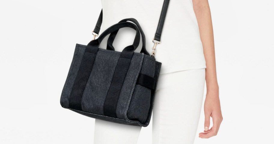 woman in white wearing a target boxy tote bag