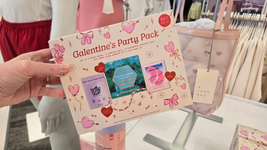 hand holding a galentines party pack in a target store