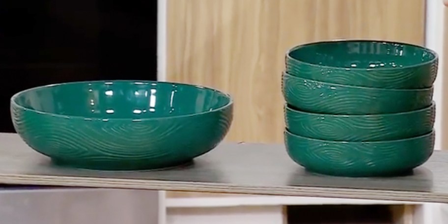 green serving bowl and 4 bowls stacked 