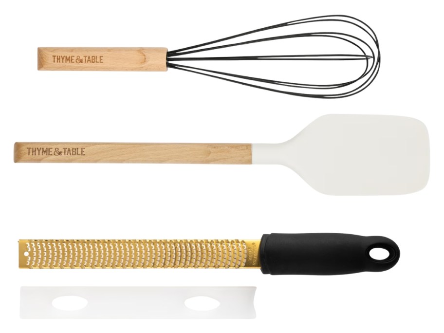 a whisk, spatula, and grater