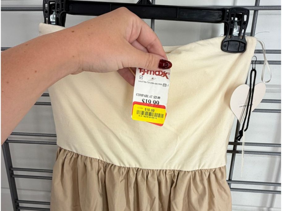 hand holding clearance tag on dress in tj maxx store