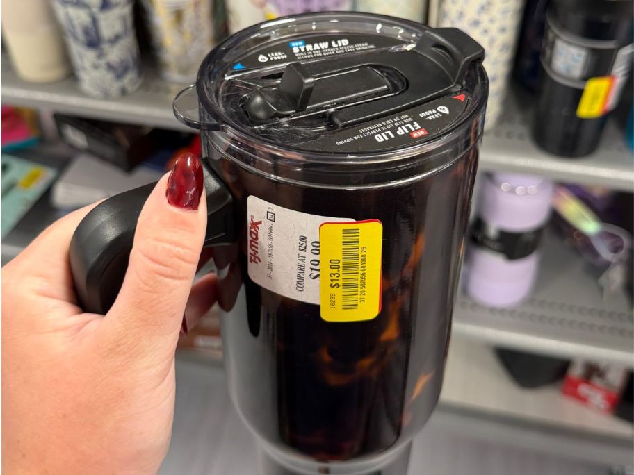 hand holding tumbler in tj maxx store