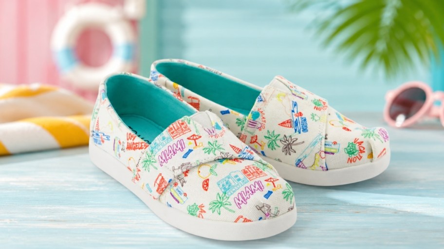 a pair of toms kids shoes