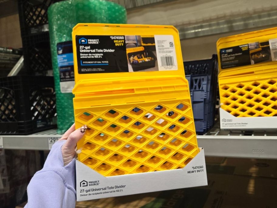 yellow Project Source 27-Gallon Stackable Tote Divider in hand in store