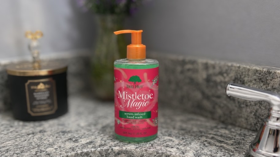 a bottle of treehut handwash next to a bathroom sink