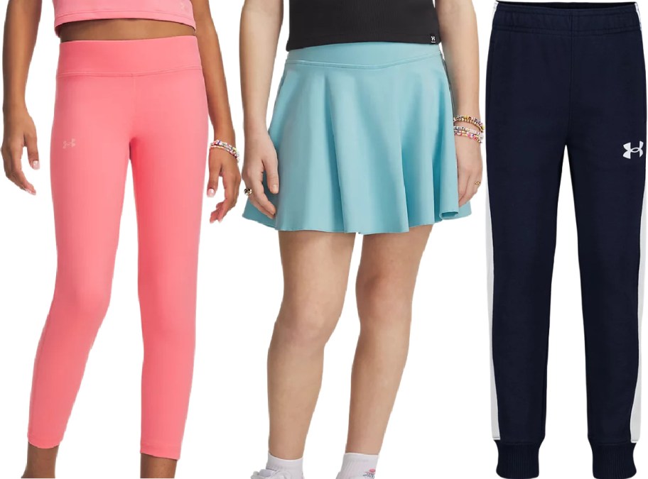Three Under Armour bottoms side-by-side: pink leggings, a light blue skirt, and navy blue track pants.