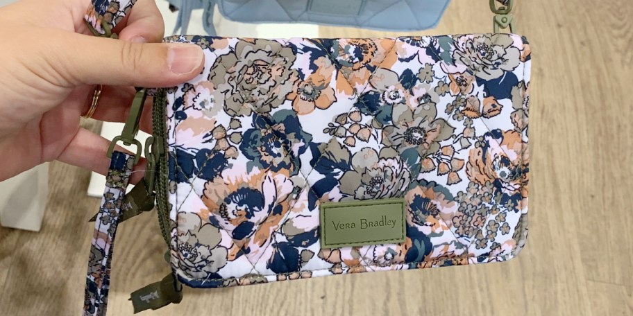 hand holding floral bag 