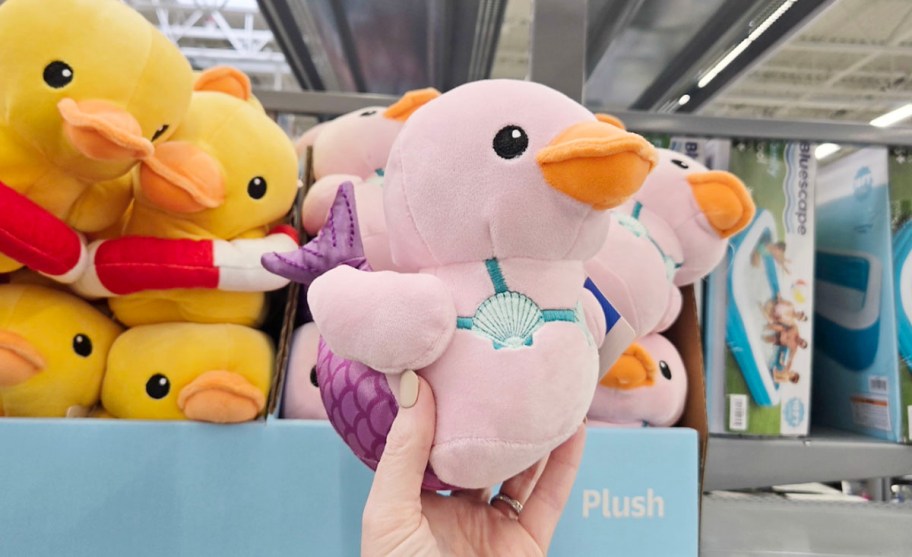 hand holding pink mermaid duck plush 