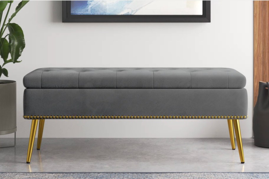 grey velvet storage bench with gold legs