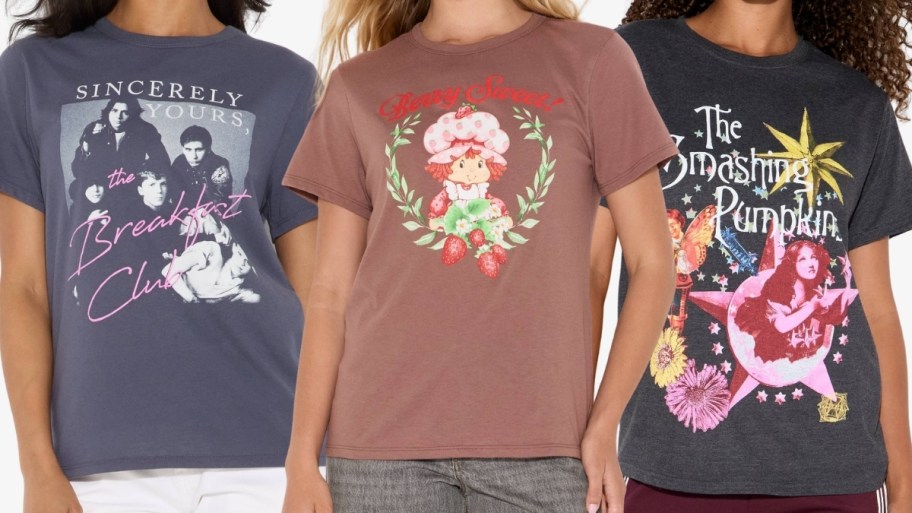 three women wearing graphic tees