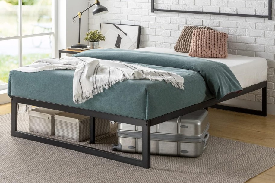 bed with blue bedding in bedroom