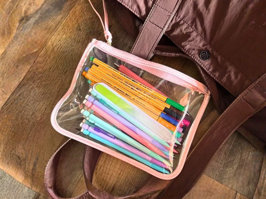 a clear wristlet filled with pens and pencils
