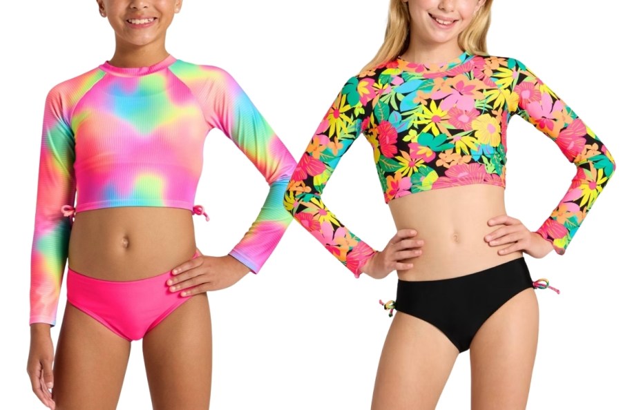 two girls wearing rash guard swimsuits