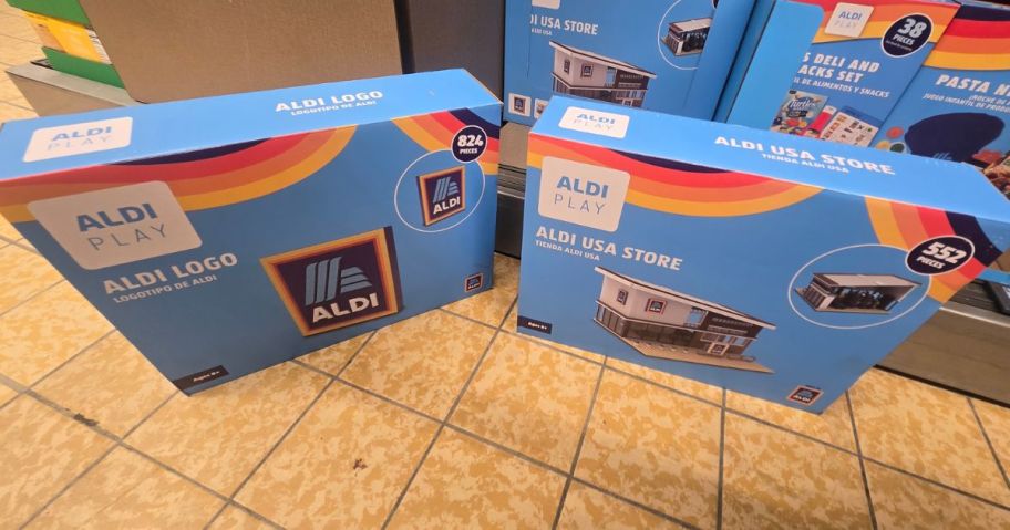 two different ALDI play sets on the floor