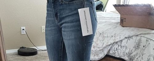 Woman wearing Amazon Essentials jeans in a mirror