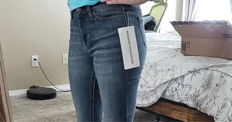 Woman wearing Amazon Essentials jeans in a mirror