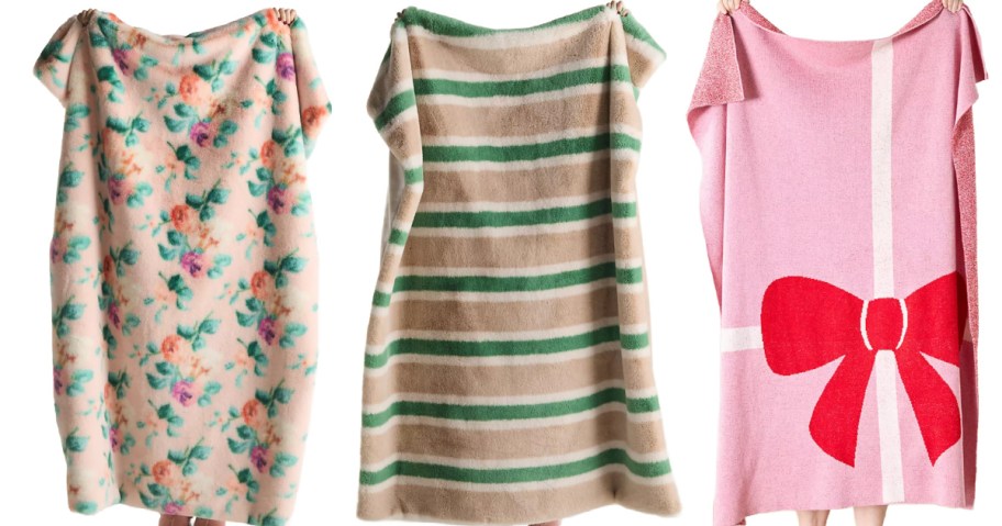 3 people holding up different anthropologie blankets