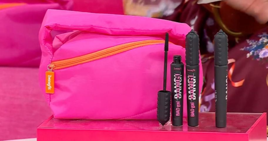 Bang bang mascara and bag on top of the table