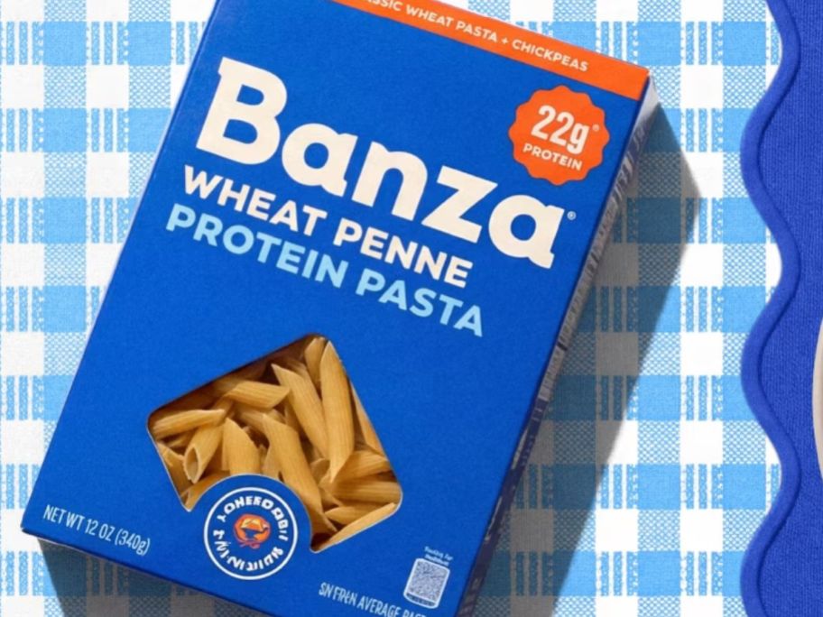 box of Banza wheat penne on blue placemat