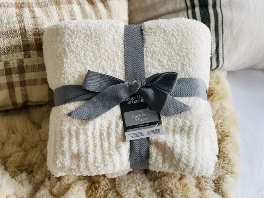 Better Homes & Gardens Cozy Knit Throw folded on couch