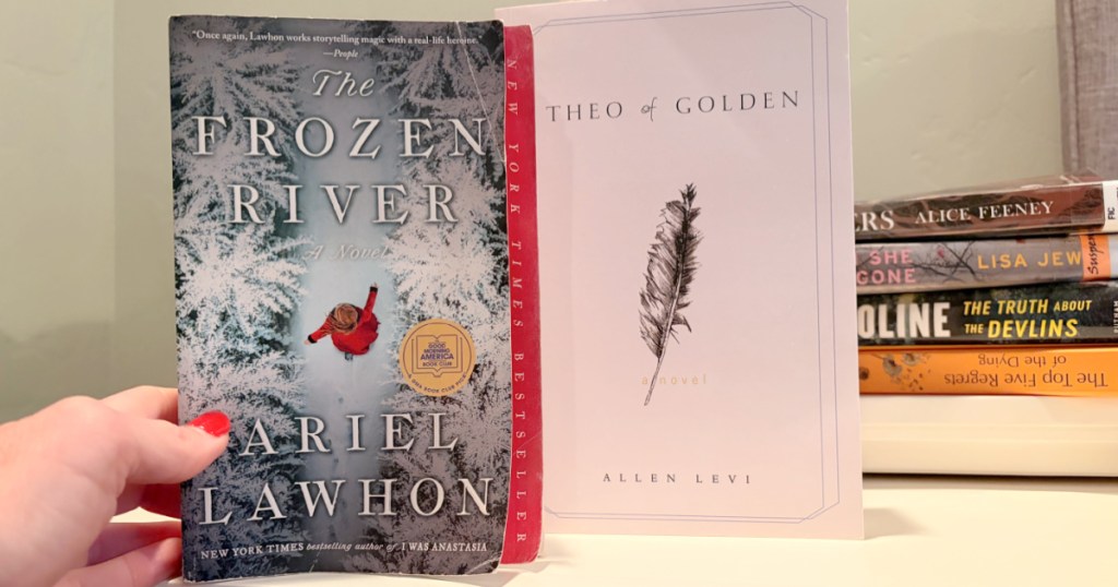 Different books on white bookshelf