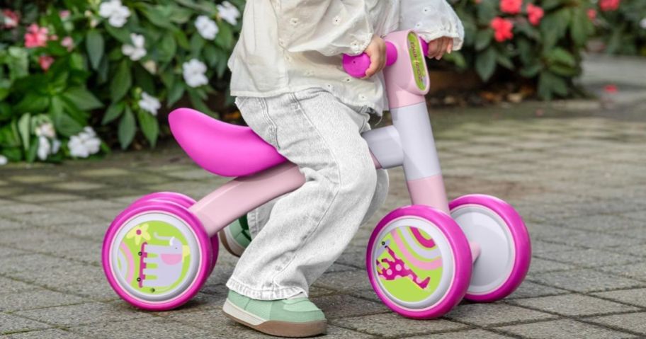 Child on bounce bike while outside