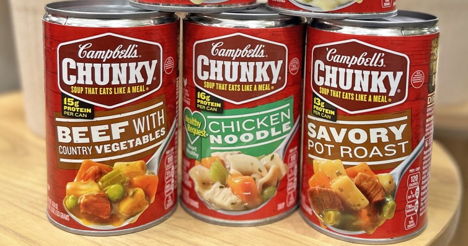 3 cans of Campbell&rsquo;s Chunky Soups on a wood table