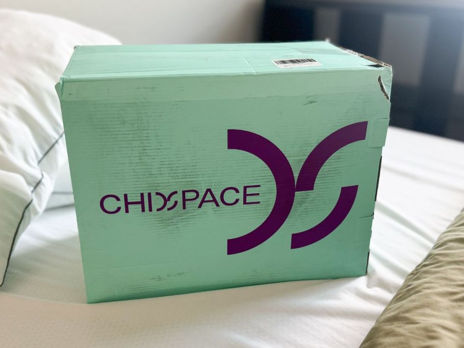 Memory Foam Mattress Topper box on bed