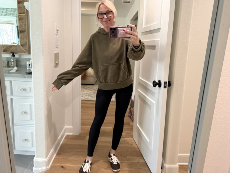 Collin wearing a hoodie and sneakers from Walmart