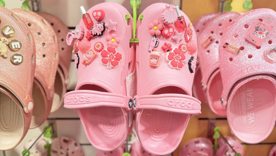 pink crocs clogs on display in store