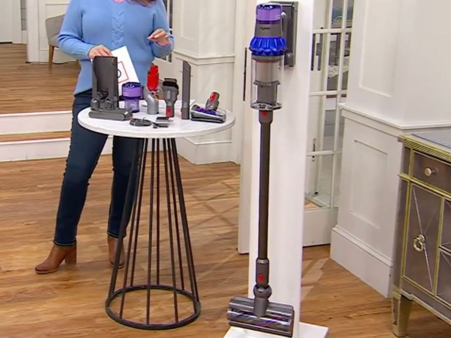 QVC dyson vacyym with all its extra accessories on top of the table