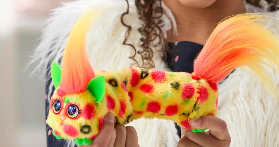 girl holding small Furby DJ Furblets Pepp-Oh-Roni Mini Electronic Plush Toy