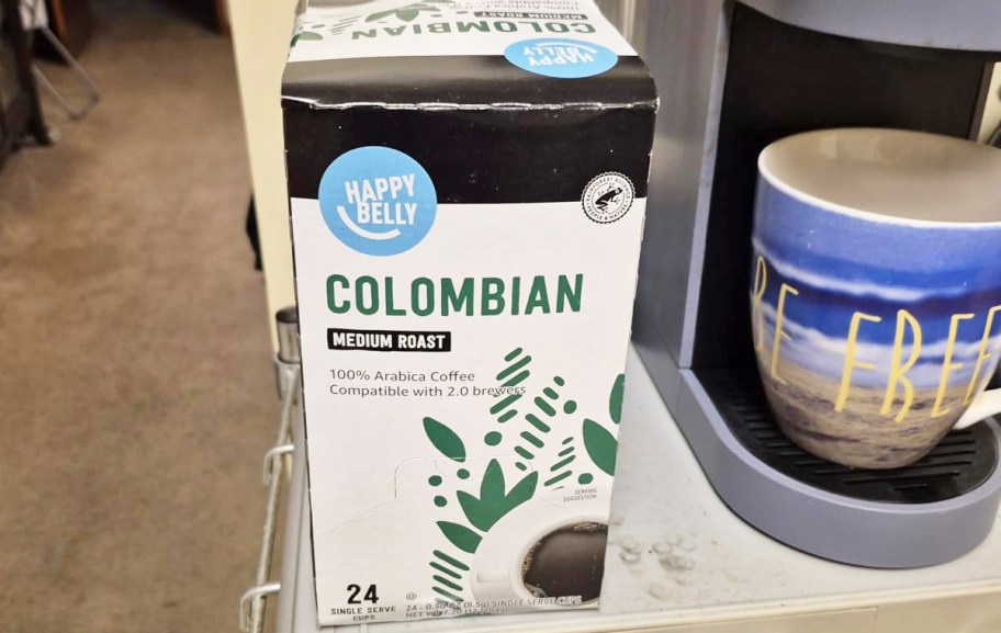 box of Happy Belly K-Cups near a coffee maker