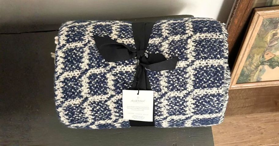 Hearth & Hand w/ Magnolia Grid Throw Blanket on ottoman