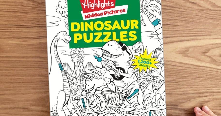 Highlights Hidden Pictures Dinosaur Puzzles book on a wood table