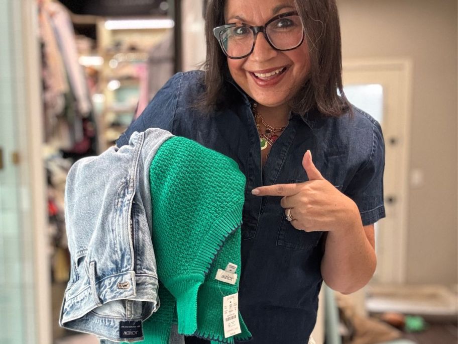 Woman holding J-Crew Clothing