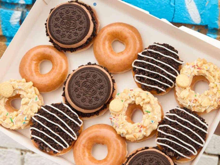 A dozen Krispy Kreme Oreo Collection Doughnuts