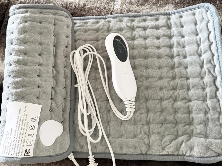large grey heating pad with white controller
